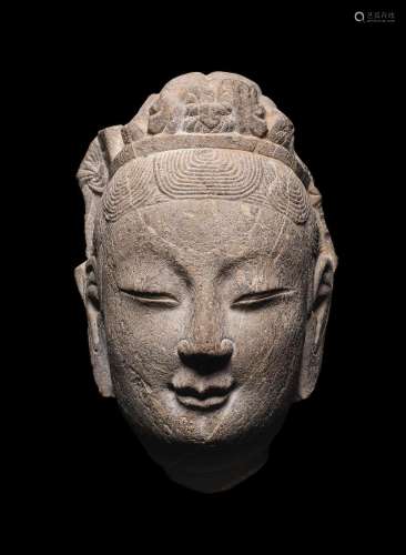 A carved stone head of a Bodhisattva
