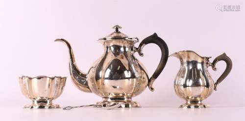 A lobed silver tea set on ebony handles, circa 1900.