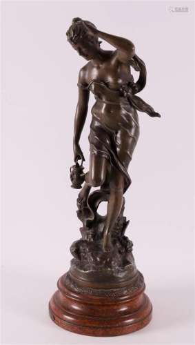 A bronzed composite metal sculpture of a woman, France