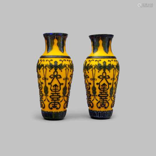 A pair of yellow-glass vases overlaid with dark lavender gla...
