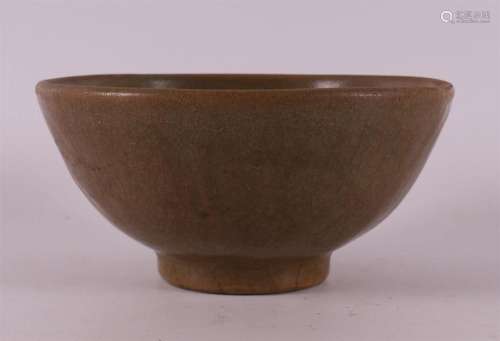 A celadon glazed bowl on a stand ring, China, Song dynasty.