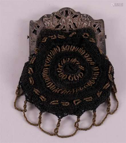 A fabric purse with an ajour silver bracket, from 1924.