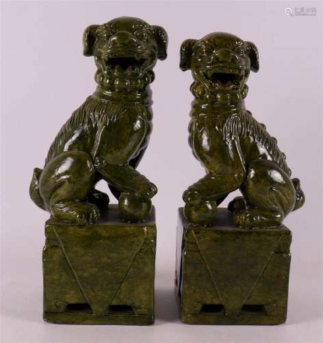 A pair of green glazed terracotta seated temple lions '...