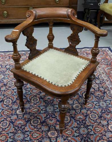 A walnut corner chair with beige fabric seat, circa 1900.