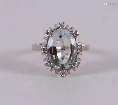 A 14 kt white gold ring with an oval facet cut aquamarine.