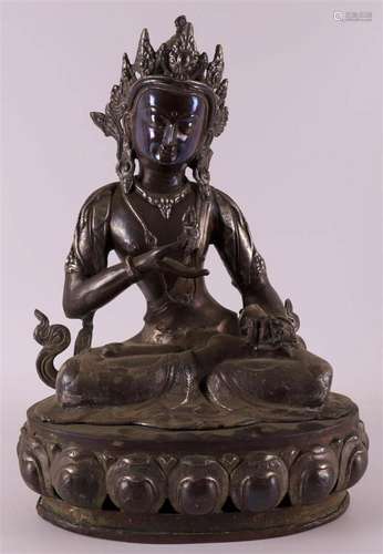 A bronze and silver plated seated goddess Tara on a lotus cr...