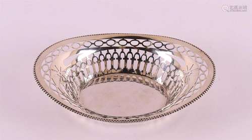 An oval silver openwork bonbon basket with pearl rim, year l...