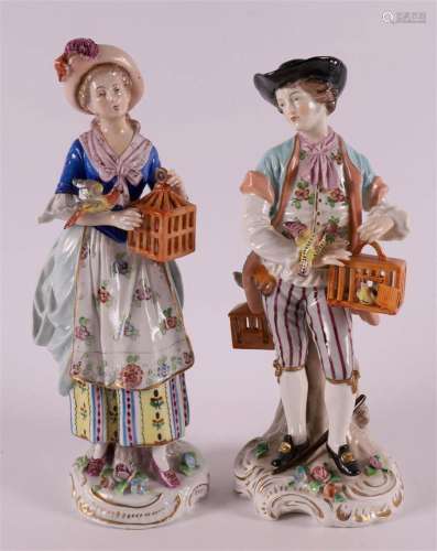 Porcelain figures of a man and woman with birdcages, Germany...