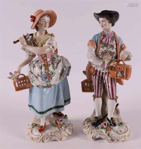 Porcelain figures of a man and woman with birdcages, Germany...
