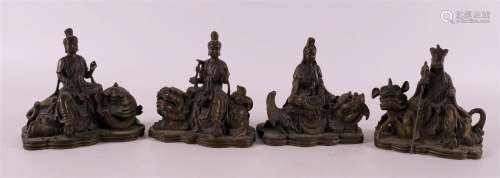 Four various bronzes of Kwan Yin on elephant and ditto on te...
