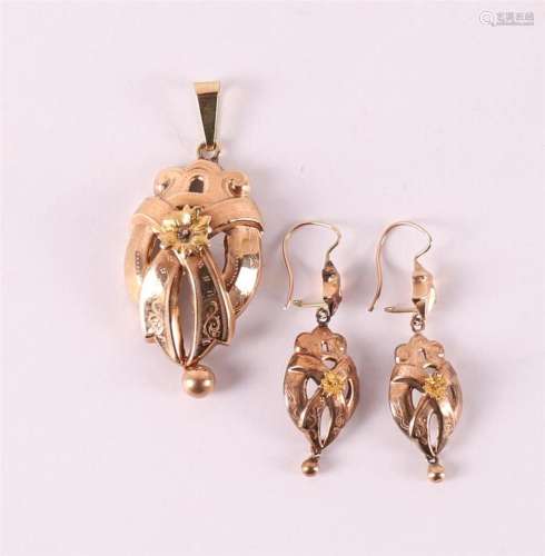 A 14 kt gold pendant and earrings belonging to the regional ...