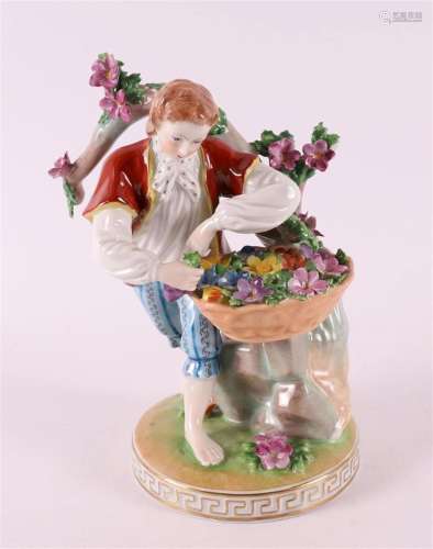 A polychrome porcelain man with a flower basket, Germany, Dr...