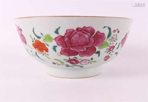 A porcelain famille rose bowl on a base ring, China, Qianlon...