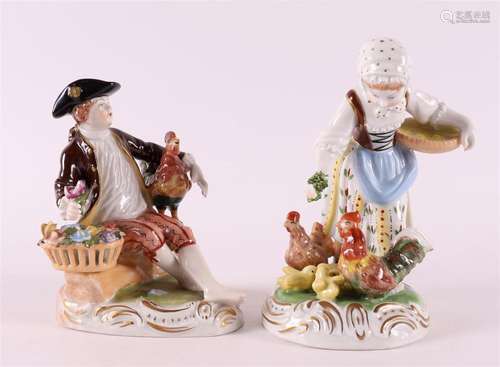 A polychrome porcelain man and woman with chickens, Germany,...