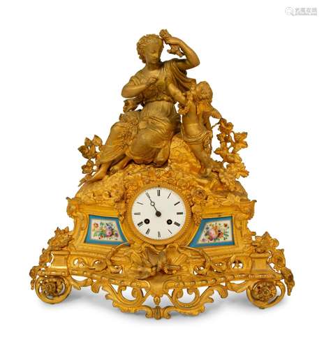 A Louis XV Style Gilt Bronze and  Porcelain Inset Mantel Clo...