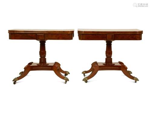 A Pair of Regency Flame Mahogany Flip-Top Games Tables Heigh...