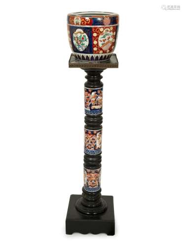 An Imari Porcelain Jardiniere on an Ebonized Pedestal with I...