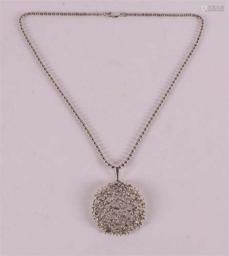 A 1st grade silver necklace with pendant.
