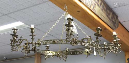 A brass candle crown, circa 1900.