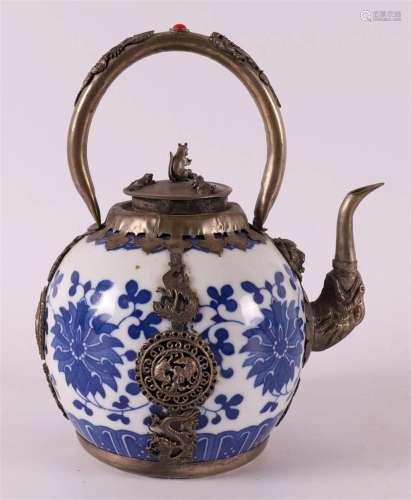 A blue and white porcelain teapot with silver mounts, China