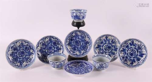 A set of three blue and white porcelain cups and six saucers...