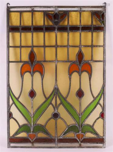 A stained glass window with a tulip motif, 20th century.