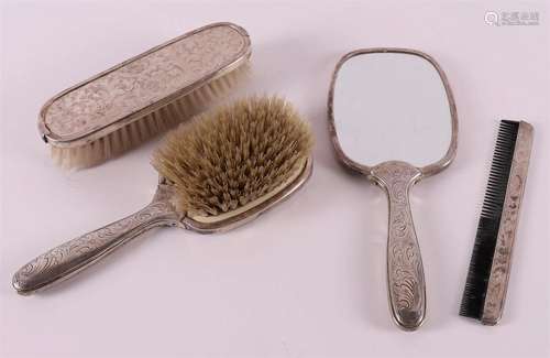 A four piece toilet set with silver mounts, around 1900.