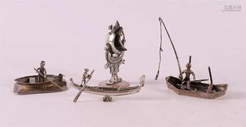 Etagère silver. A silver fisherman in a boat, 20th century.