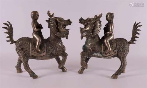 A pair of bronze Kylin with rider, China 20th century.