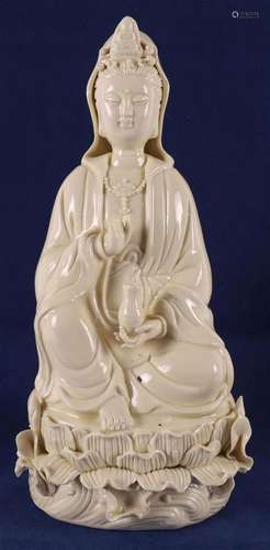 A seated Blanc de Chine standing Kwan Yin, China, late 19th/...