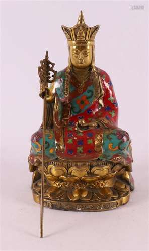 A bronze and cloissoné seated Buddha with crown and staff on...