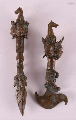 Two bronze ruyi scepters, China, after an antique 20th centu...