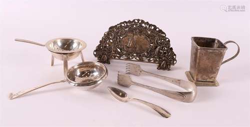 A lot of various silver, including tea strainer, napkin hold...