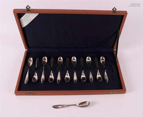 A set of twelve silver mocha spoons in cassette, pointed fil...