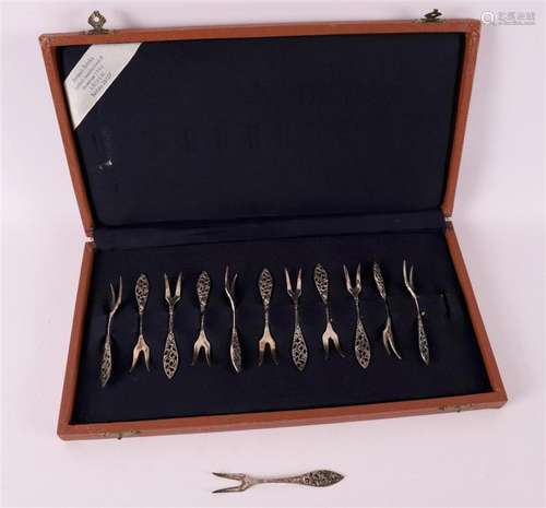 A set of twelve 2nd grade silver cake forks in a case, 20th ...