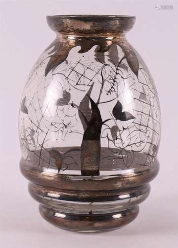 A clear glass Art Deco vase with a silver floral frame, ca. ...