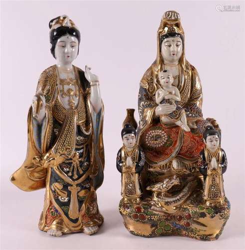 A polychrome Satsuma porcelain seated Kwan Yin with children...