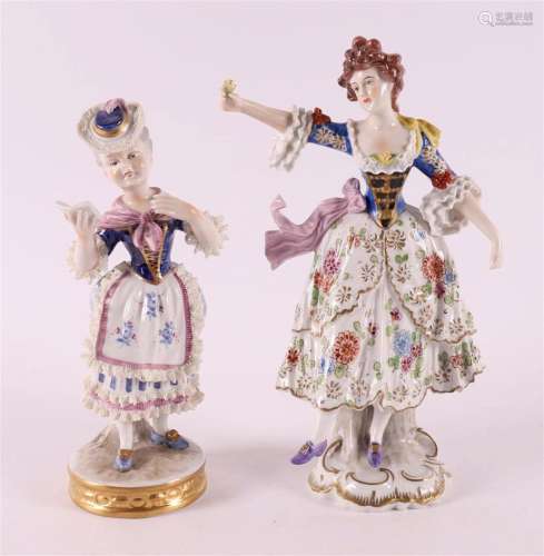 Two polychrome porcelain figures, including a woman with a b...