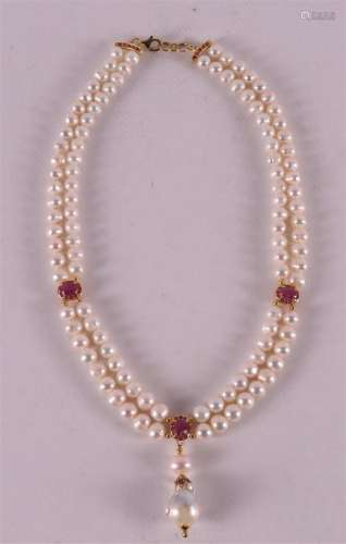 A necklace of pearls on a gold-plated silver clasp with a pe...
