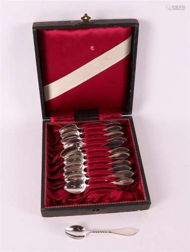 A set of twelve silver lawyer spoons in a case, early 20th c...