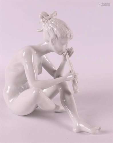 A white porcelain flute player as a seated nude, Germany 195...