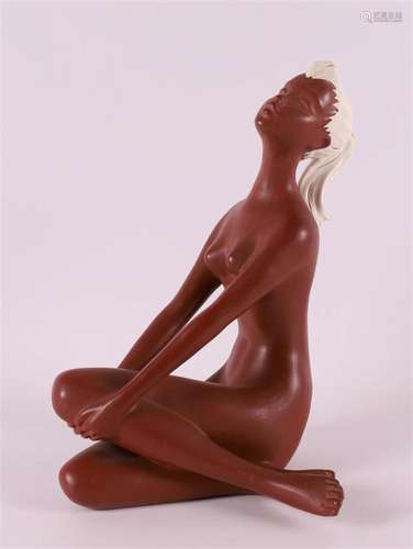 A terracotta seated female nude with ponytail, 1950s.