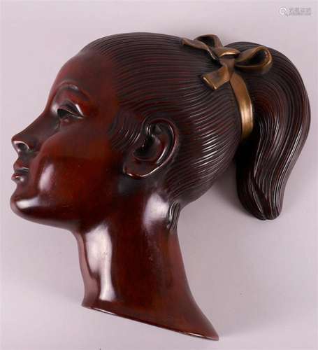 An Achatit pottery mask of a girl with ponytail, Germany