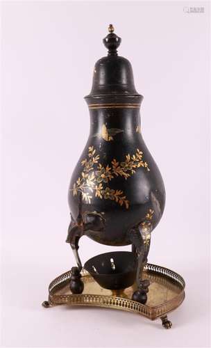 A black lacquered tap jug with gilded floral decoration with...