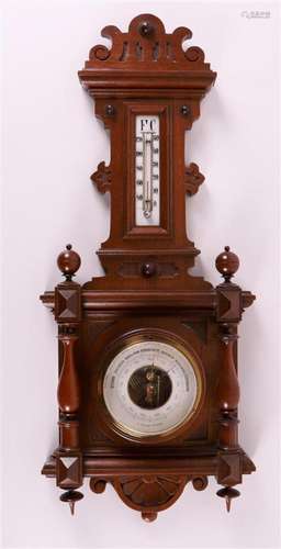 A baro-thermometer in walnut housing, around 1900