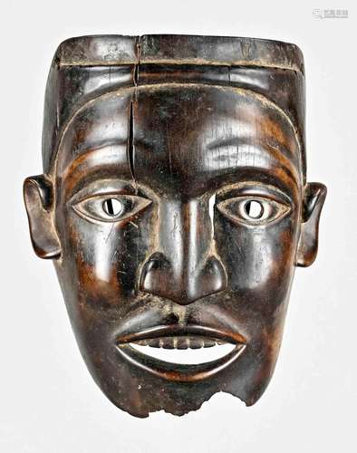 Wooden mask with expressive face, c