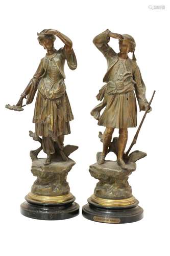 A pair of French patinated pewter sculptures. A Greek Couple