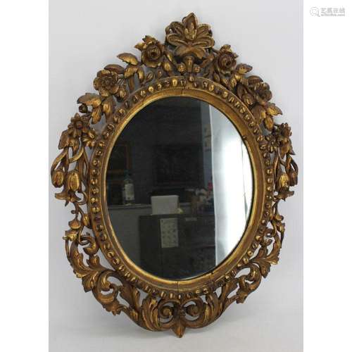 Antique And Highly Carved Giltwood Mirror.