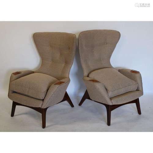 A Pair Of Upholstered Wing Back Chairs