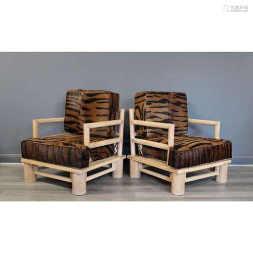 A Pair Of Hide Upholstered Arm Chairs In The